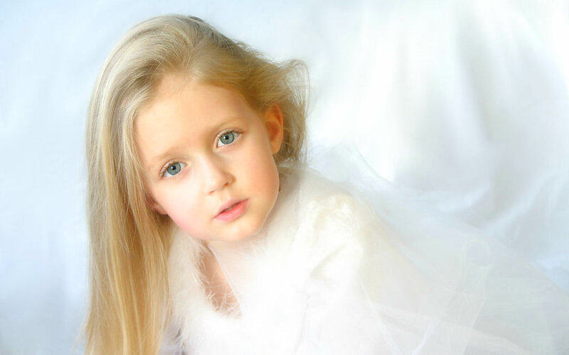 Young Girl with Blonde Hair — White, Serene