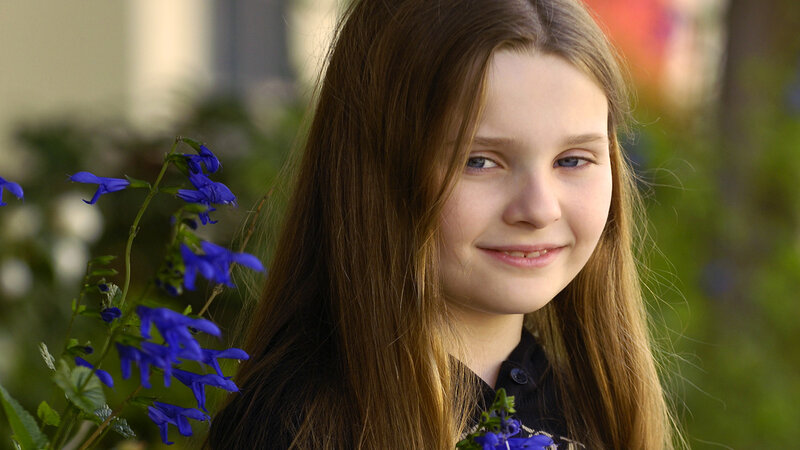 Young Girl with Blue Flowers