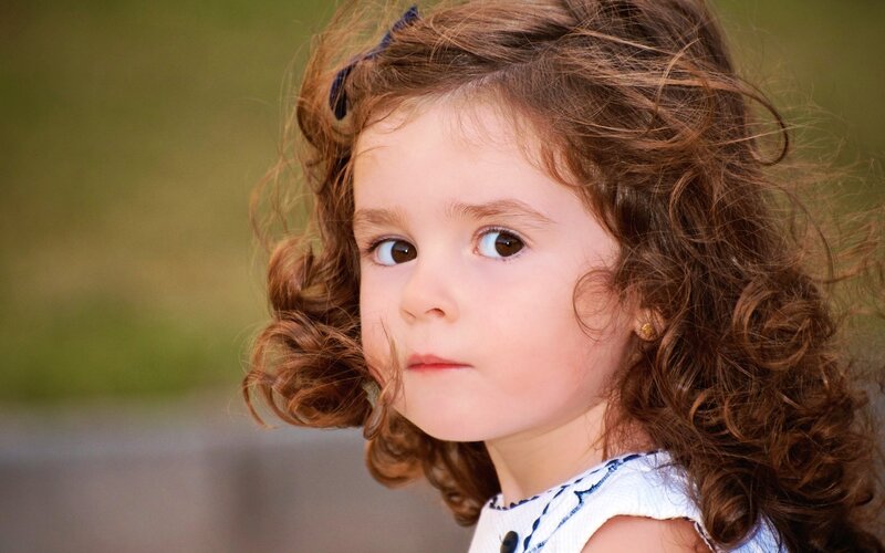Young Girl with Curly Hair — Brown, Calm, Afternoon