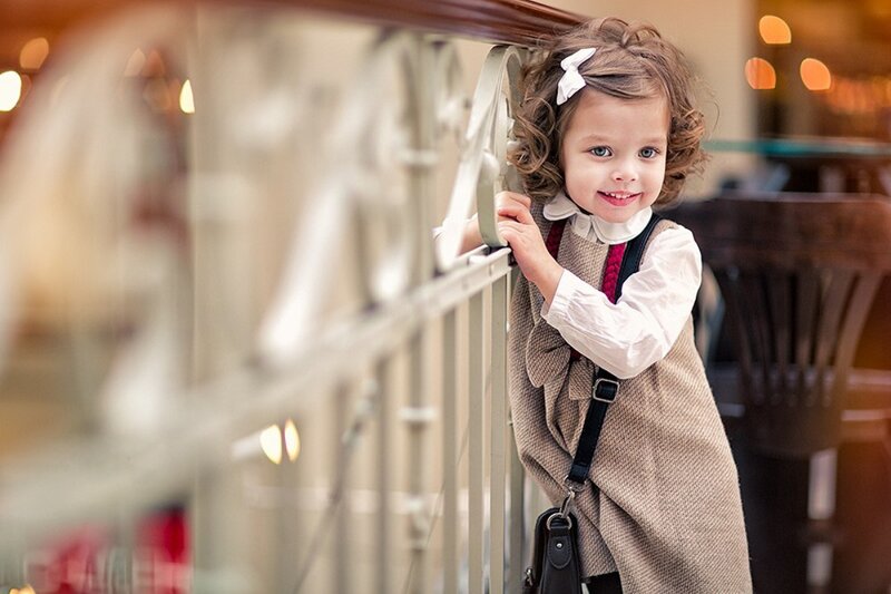 Young Girl with Curly Hair — Brown, Playful