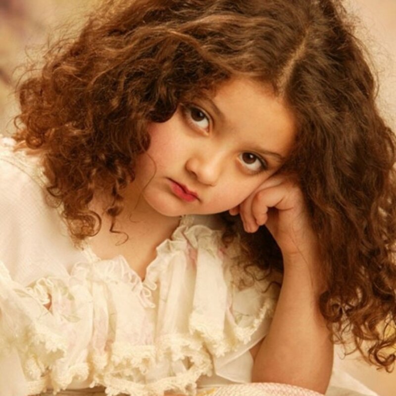 Young Girl with Curly Hair — Brown, Thoughtful, Photograph