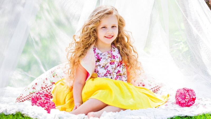 Young Girl with Curly Hair — Yellow, Serene, Afternoon