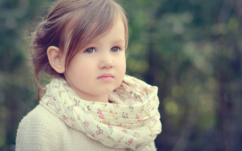 young girl with floral scarf