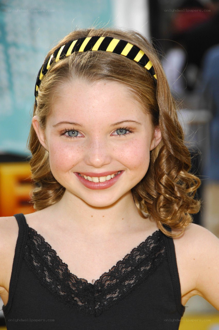 Young girl with headband smiling