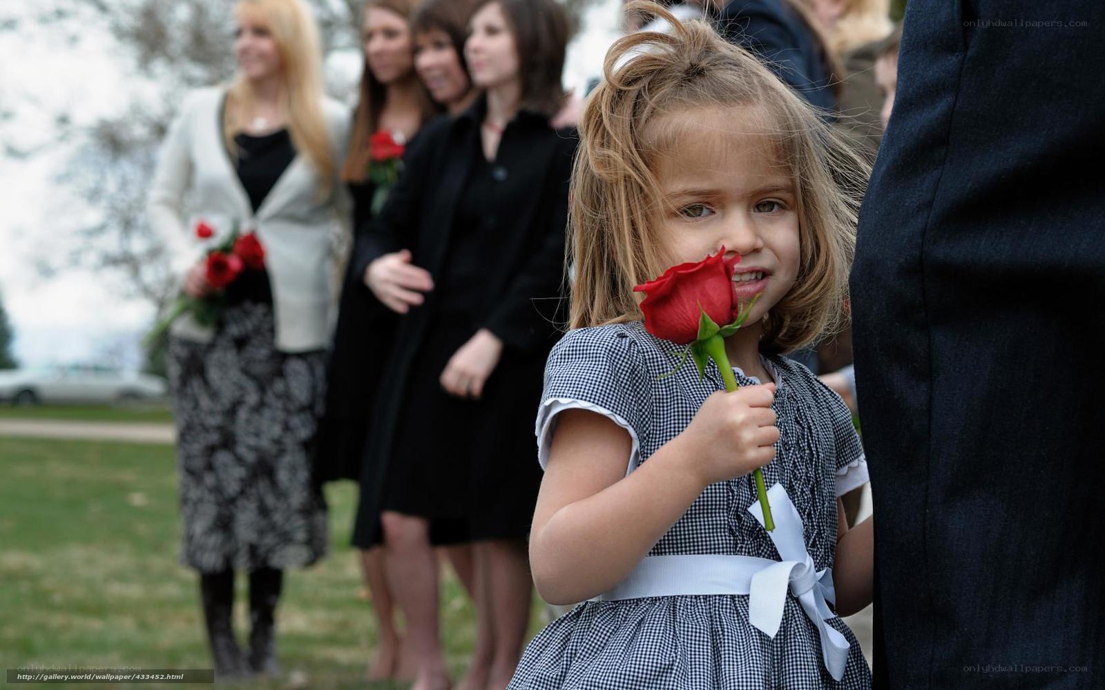 Young girl with red rose