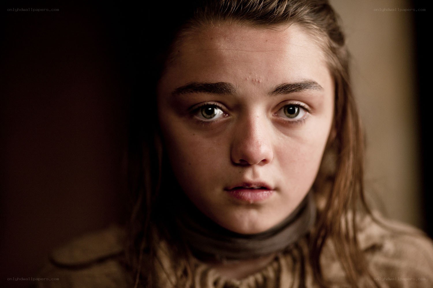 young girl with somber expression
