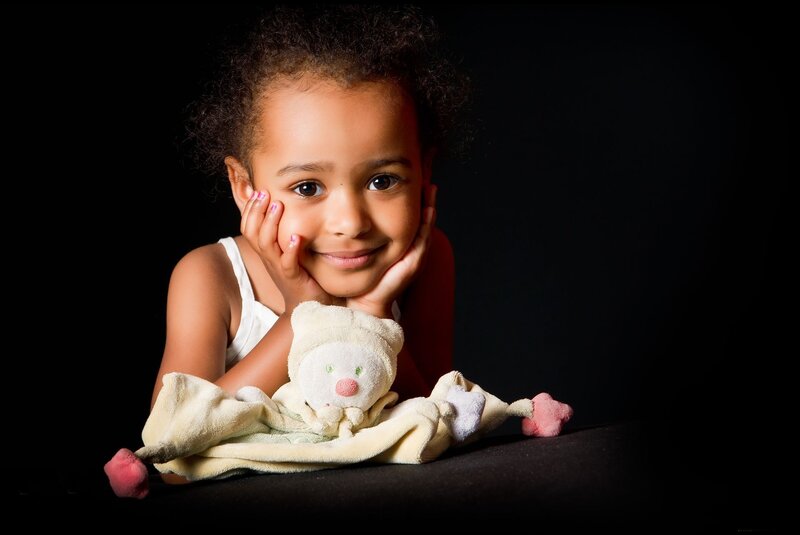 Young Girl with Stuffed Toy
