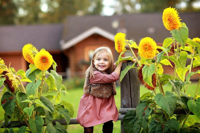 Young Girl with Sunflowers — Yellow