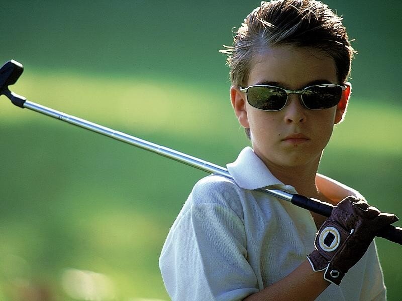young golfer with club