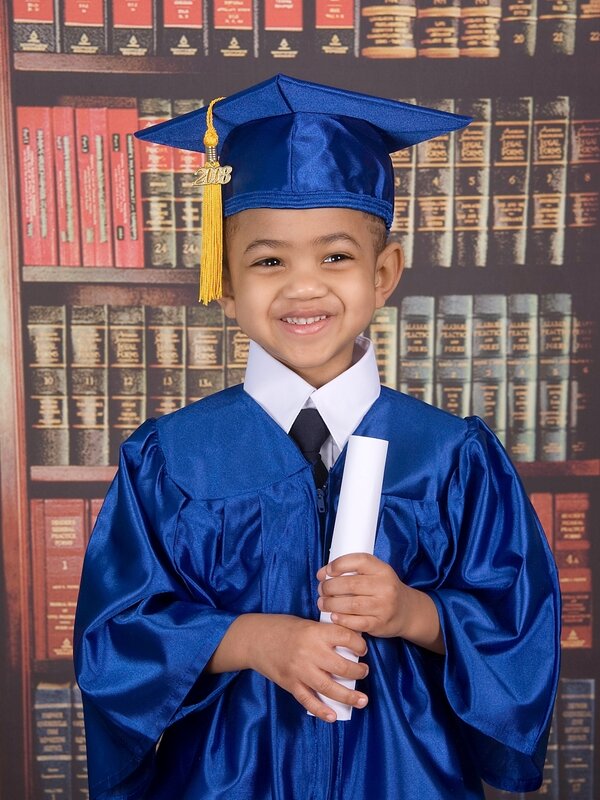Young graduate in blue cap and gown