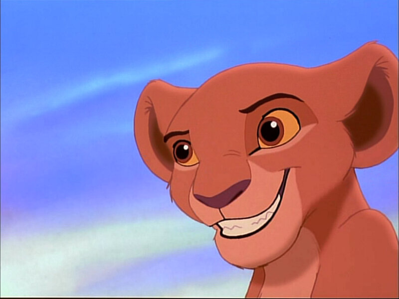 young lion cub smiling