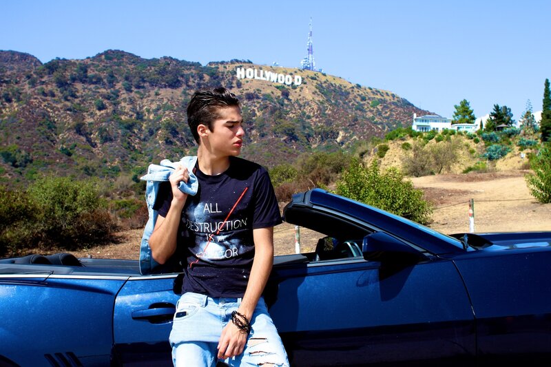 Young man at Hollywood sign