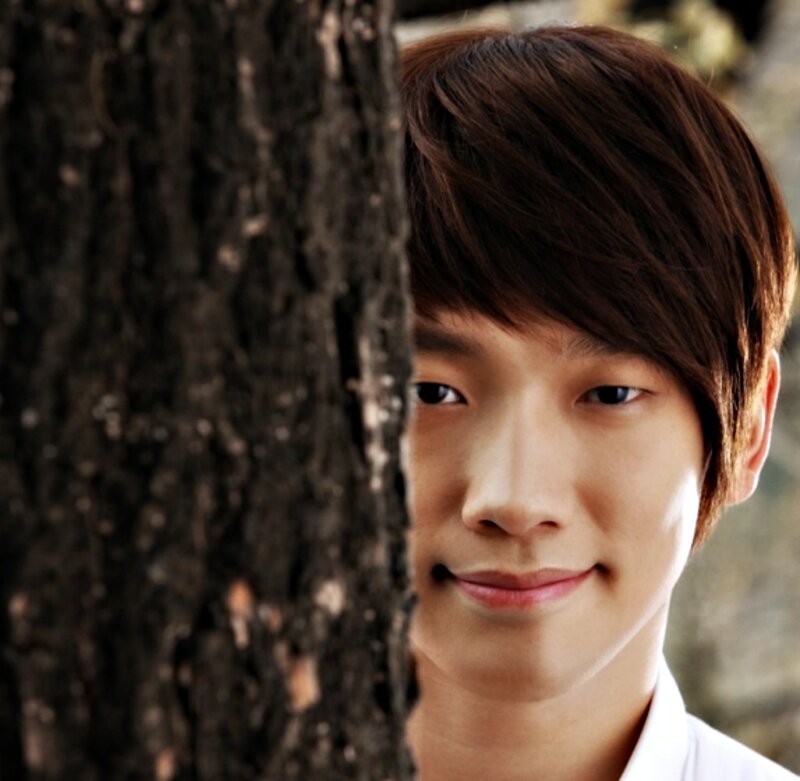 Young Man Behind Tree