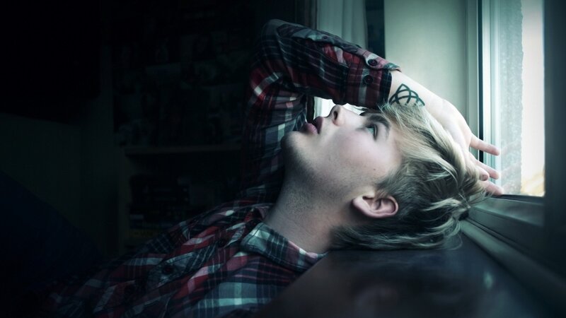 Young Man by Window