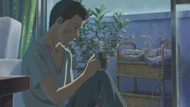 Young Man Holding Cup