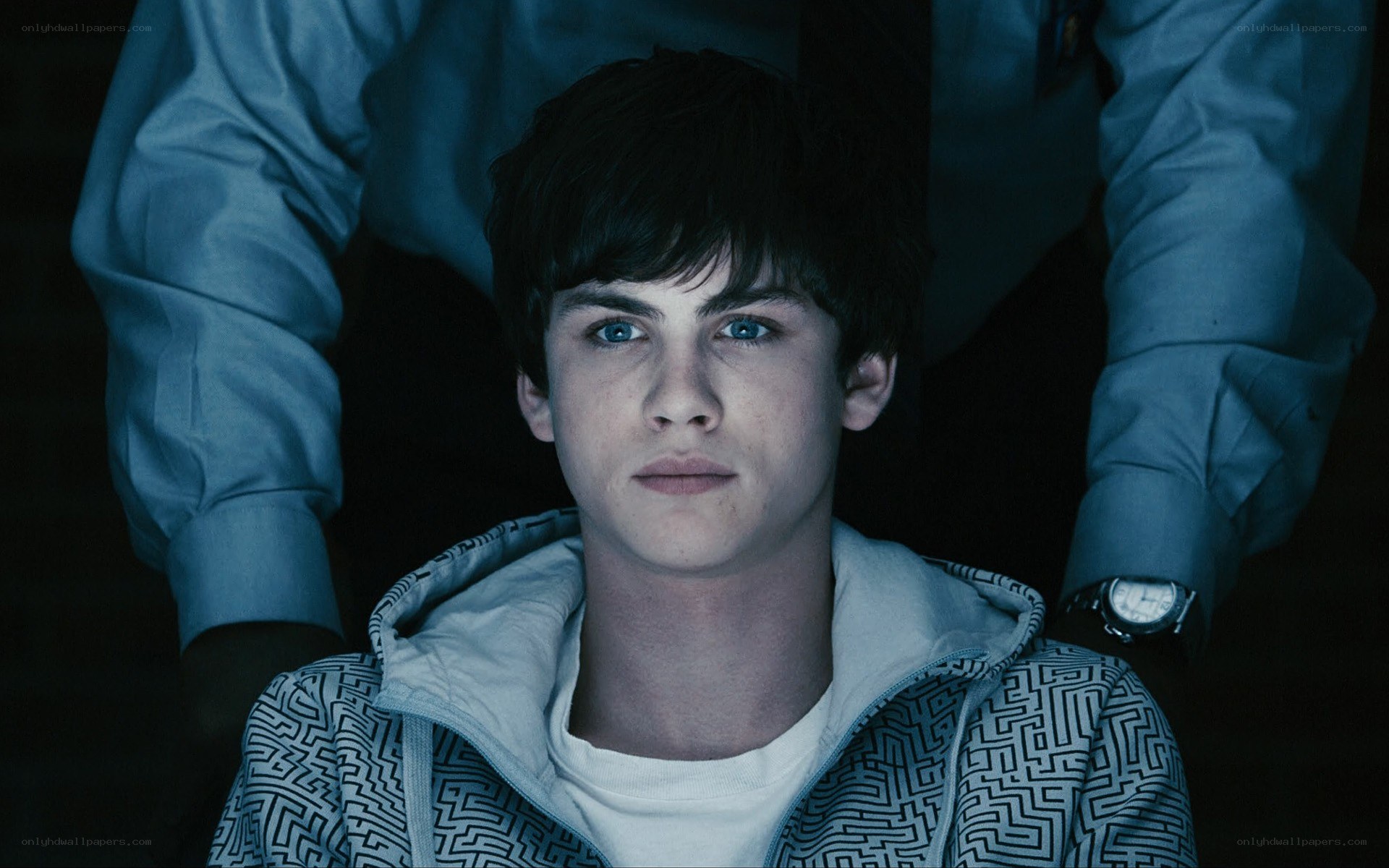 Young man in a dark room