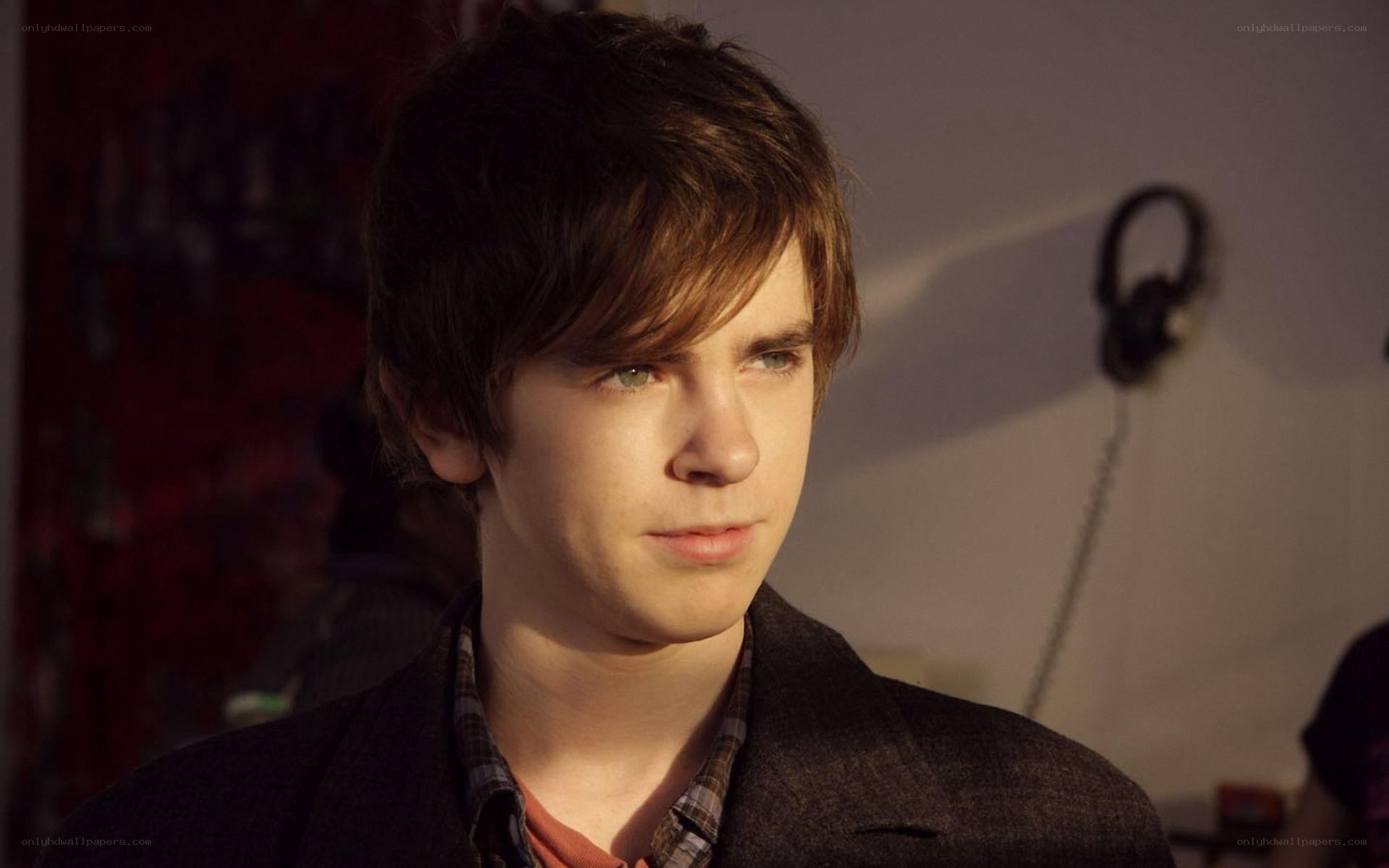 young man in a dark room