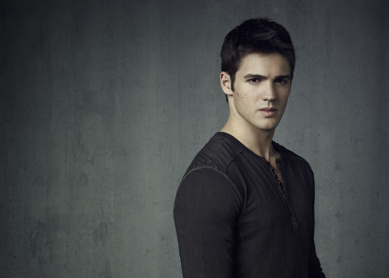 Young Man in Black Shirt — Gray