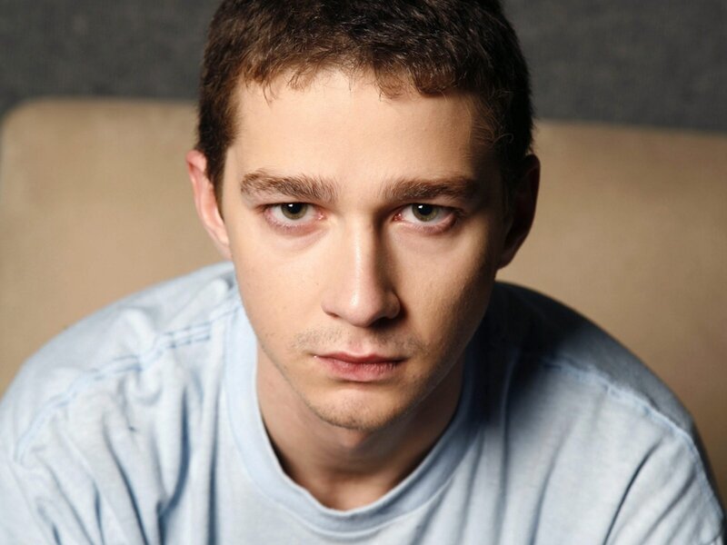 Young Man in Blue Shirt — Serious