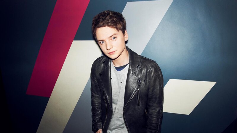Young Man in Leather Jacket — Black, Serious