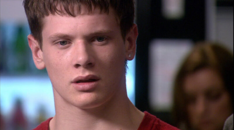 young man in red shirt
