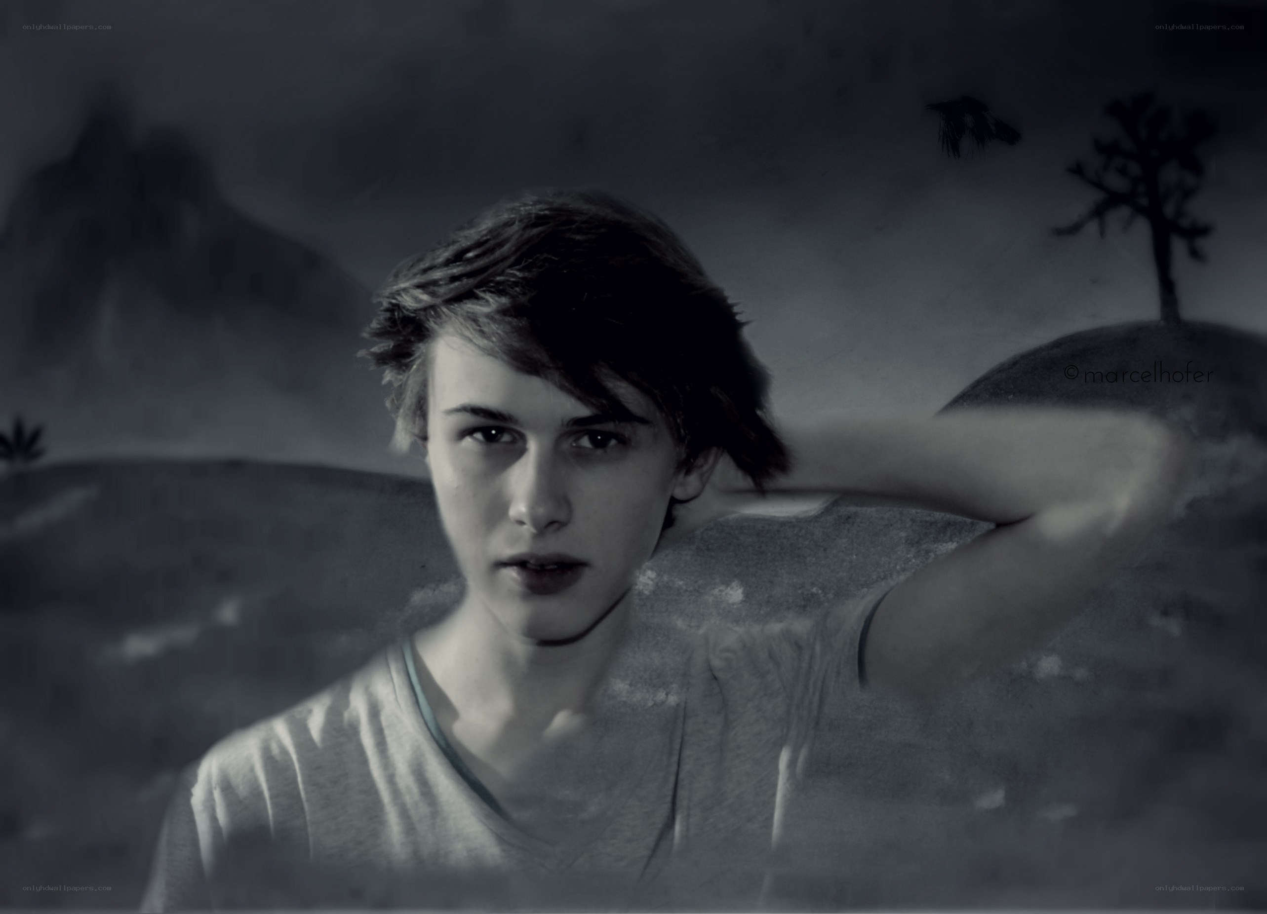young man in surreal landscape