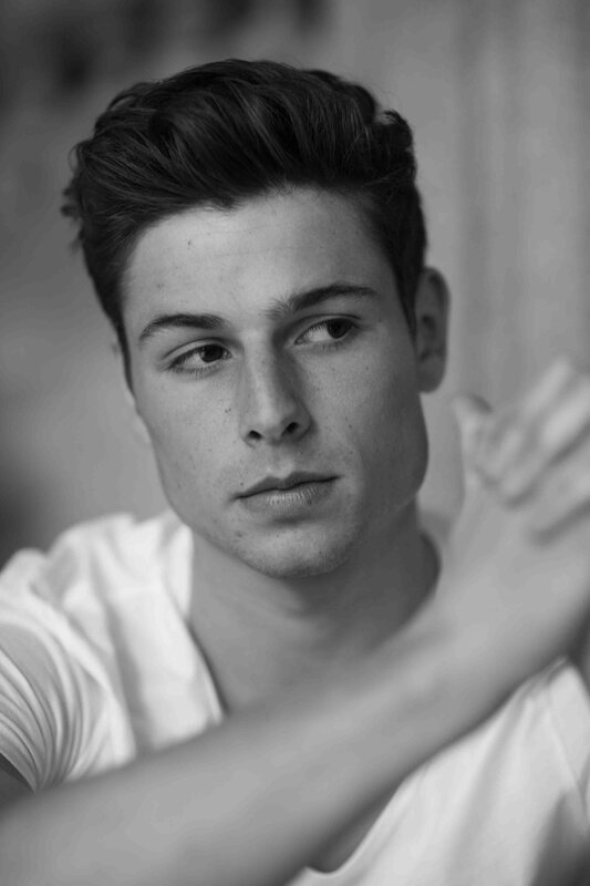Young Man in White Shirt — Black, Contemplative