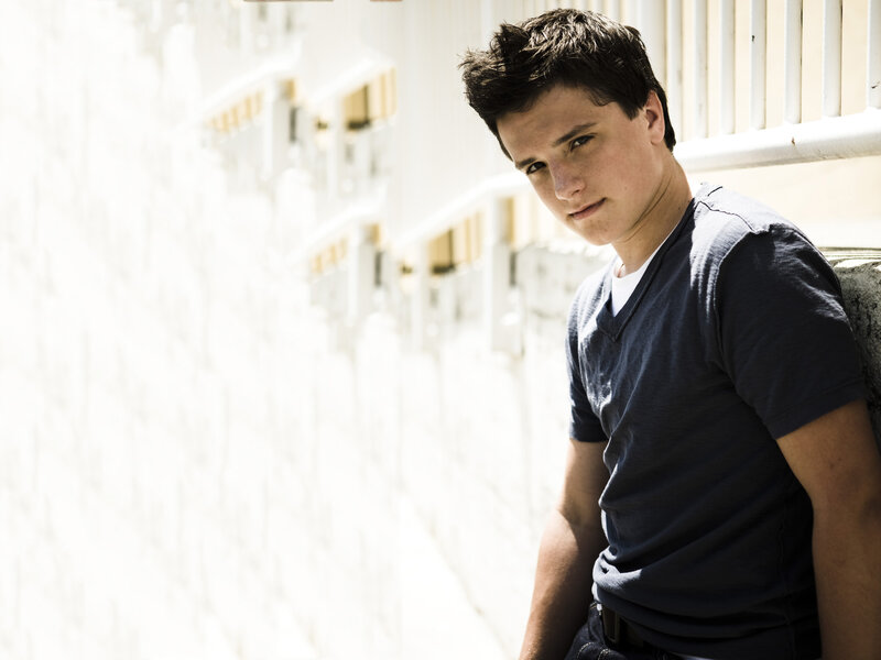 Young Man Leaning Against Wall