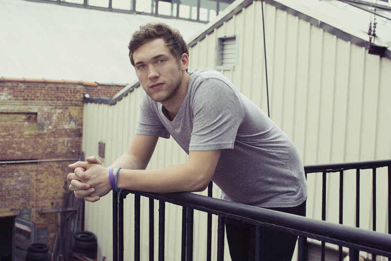 Young Man Leaning on Railing