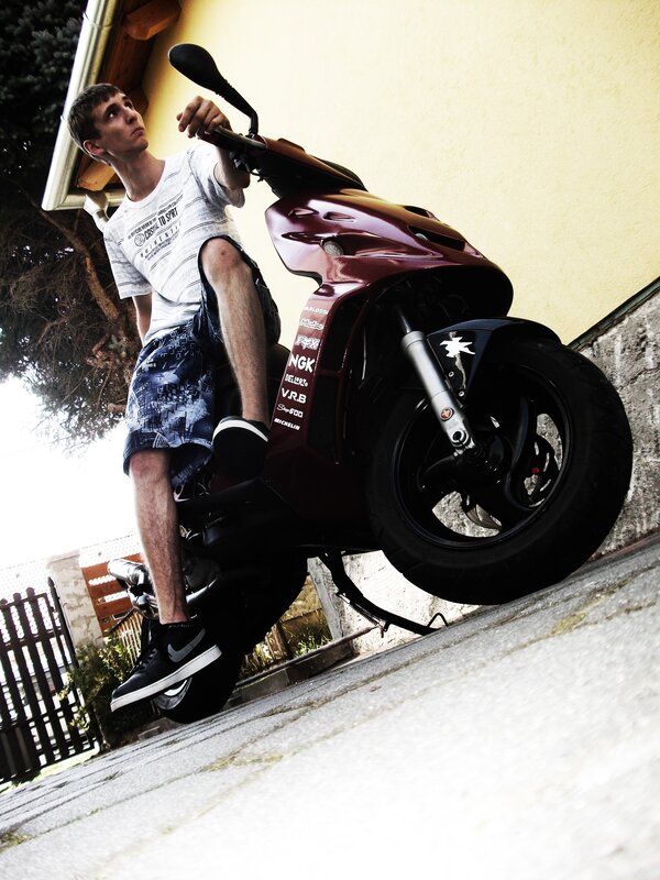 Young man on a scooter