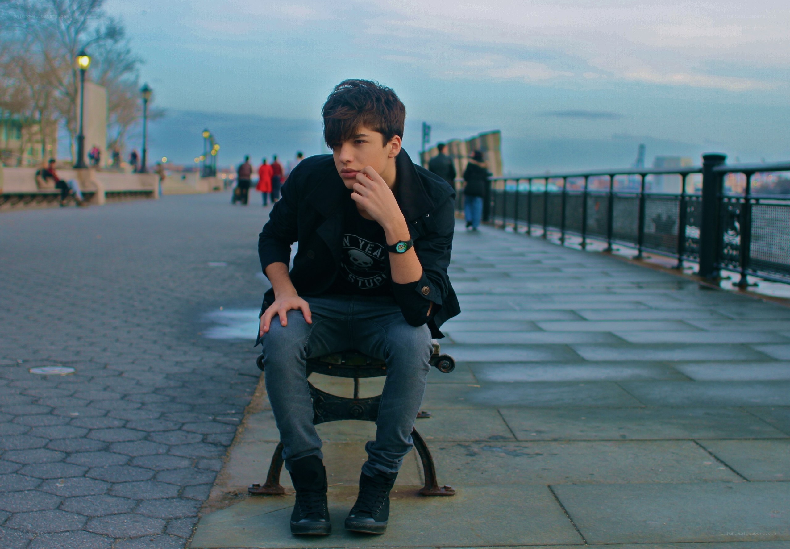 young man sitting on bench