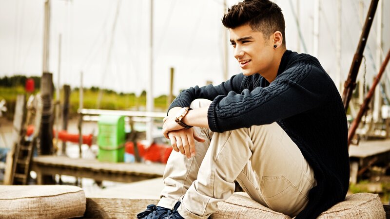 Young Man Sitting on Dock — Black
