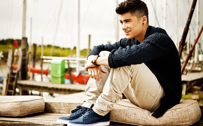 Young Man Sitting on Dock — Blue