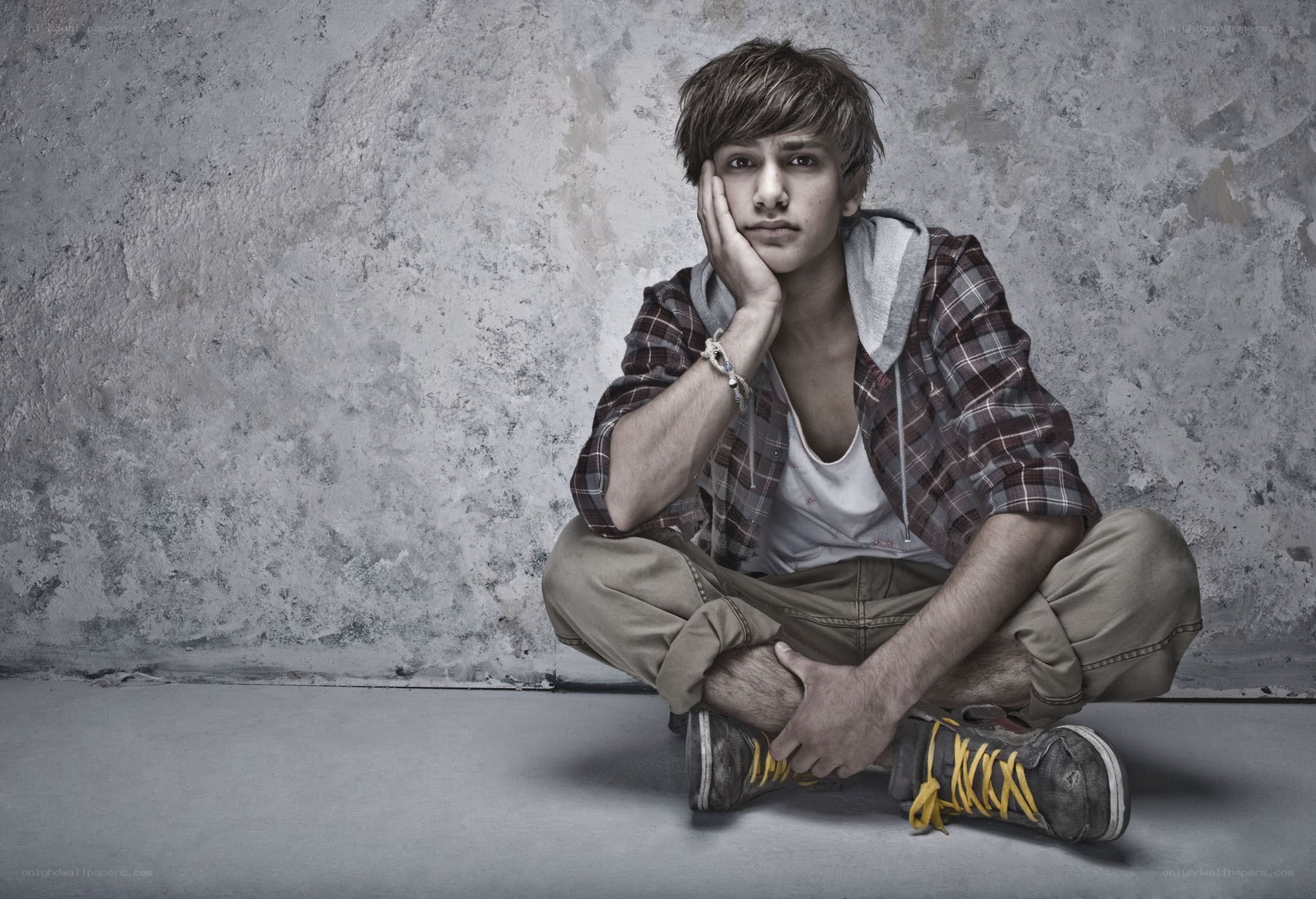 young man sitting on floor