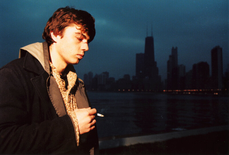 Young Man Smoking Cigarette — Blue