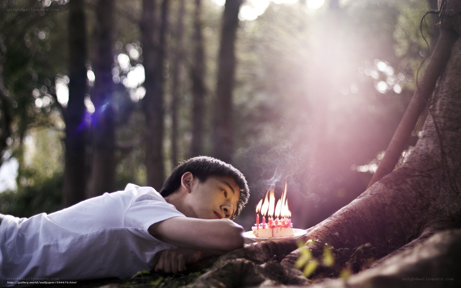 Young man with birthday cake