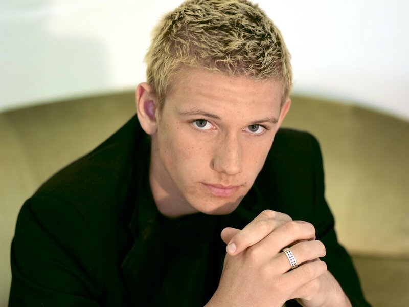 Young Man with Blonde Hair — Green, Serious