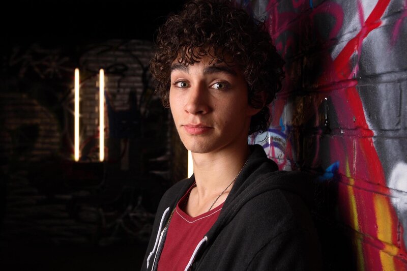 Young Man with Curly Hair — Black, Dramatic