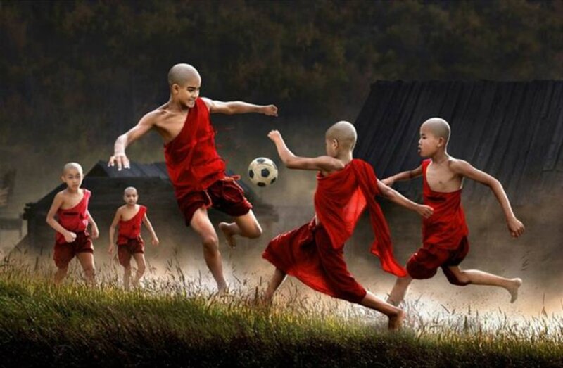 Young Monks Playing Soccer