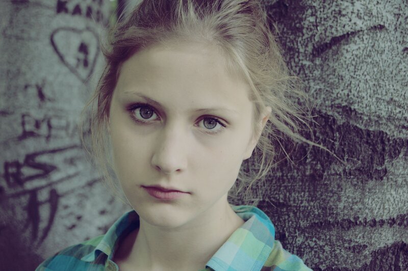Young Woman Against Wall