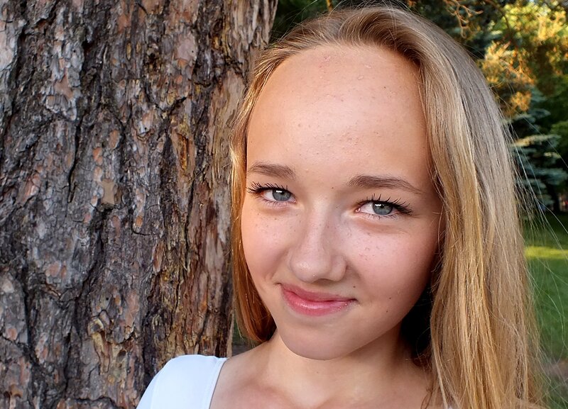 Young Woman by Tree