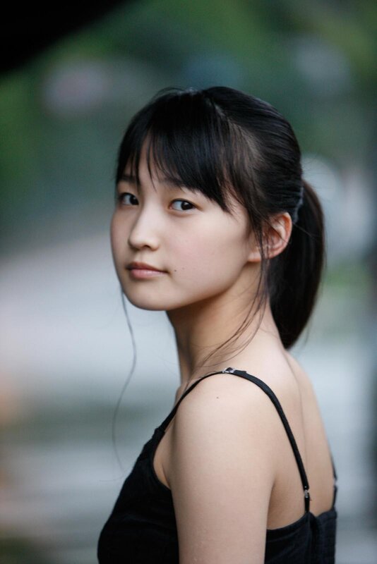 young woman in black top