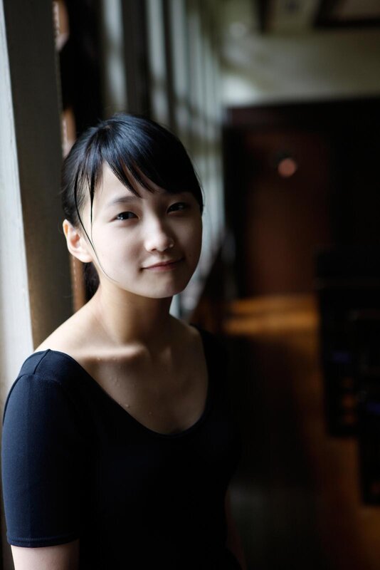 young woman in black top