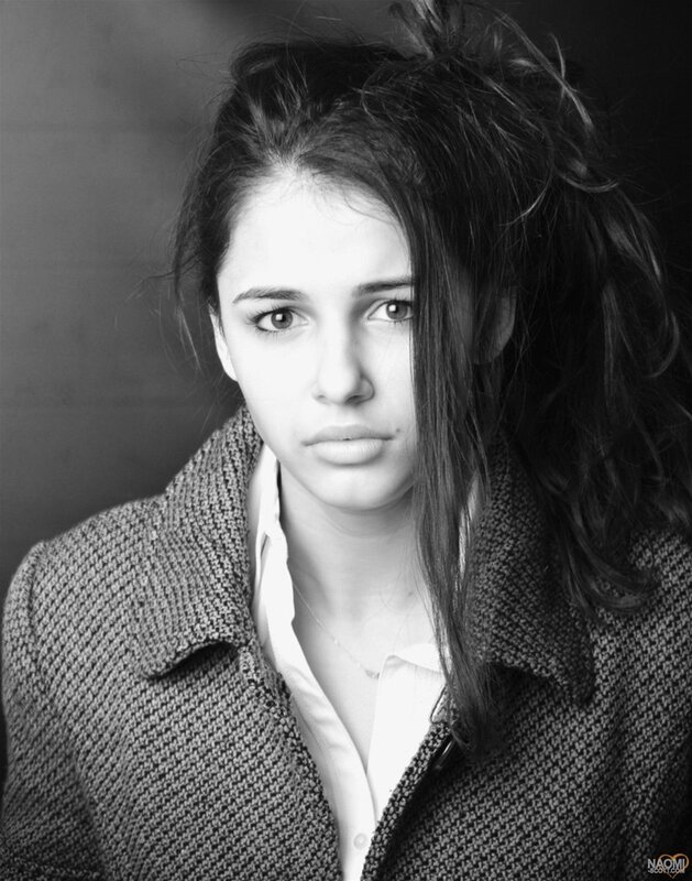 Young Woman in Coat — Black, Serious