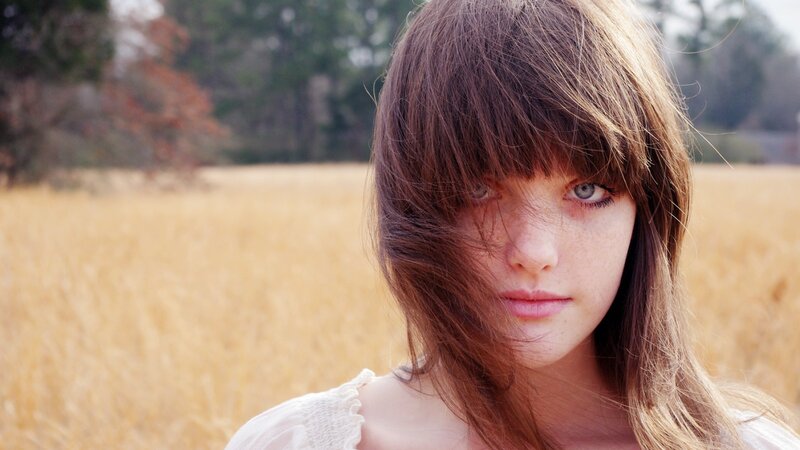 Young Woman in Field — Brown, Calm