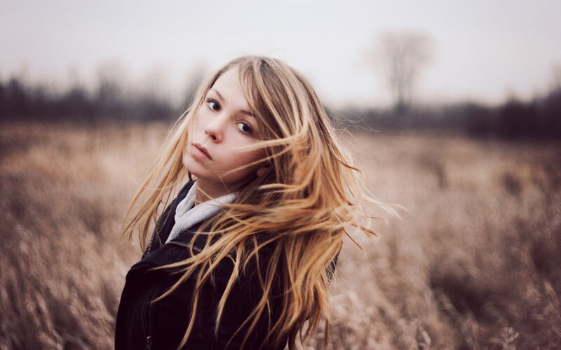 Young Woman in Field — Brown, Windy