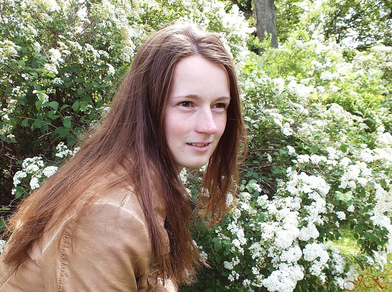Young Woman in Garden — Brown
