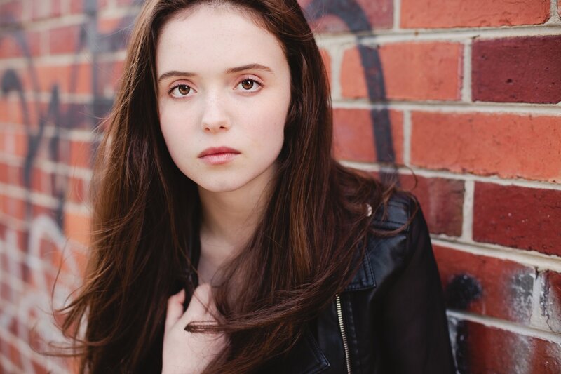 young woman in leather jacket
