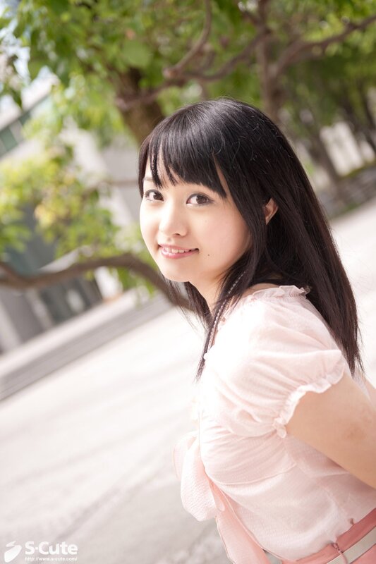 Young woman in pink blouse
