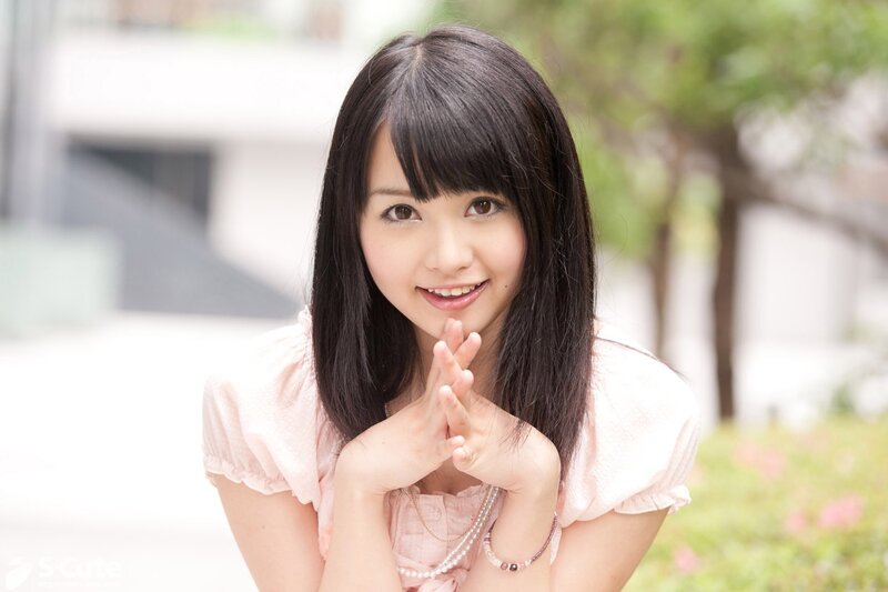 Young woman in pink blouse
